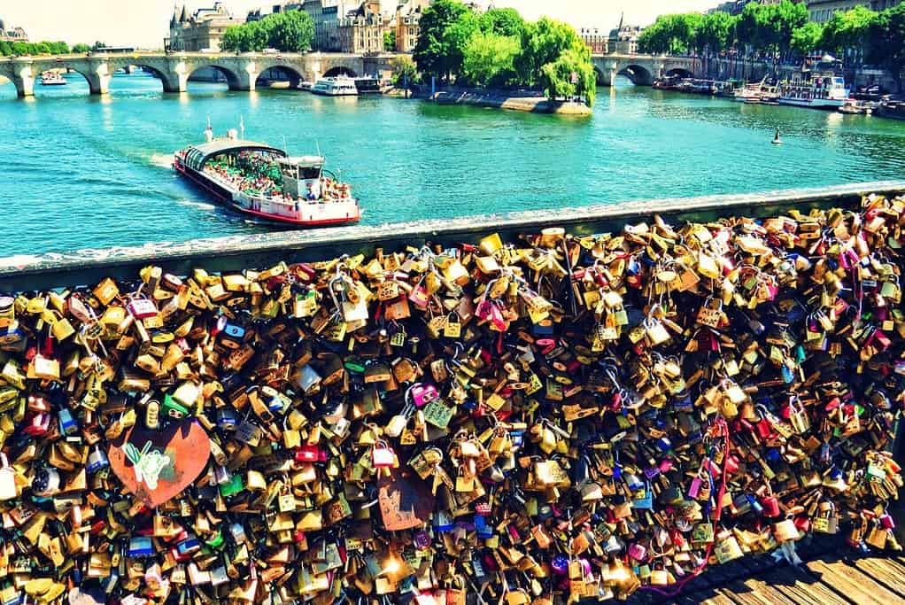 Lover's Bridge covered with pad locks in Paris France